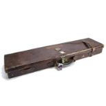 Shooting, a vintage Holland & Holland, leather covered wooden shotgun case with central positioned