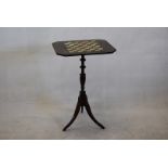 A vintage games table, having inlaid chequered board, on turned support, with tripod base, 74cm