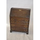 An early 19th Century oak student's bureau, of small size, with fall-front and four graduated