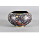 A Meiji Period cloisonné circular footed bowl, decorated with winged horses, signed to base, 15cm