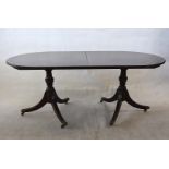 A D end dining table, complete with two leaves, 182cm long without leaves, on tripod bases, with