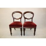A harlequin set of twelve 19th Century balloon back dining chairs,