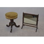 A Victorian mahogany circular piano stool, on splayed scroll tripod supports, 48cm high, and