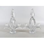 A pair of French art deco colourless glass twin branch candlesticks, by Art Vannes with acid