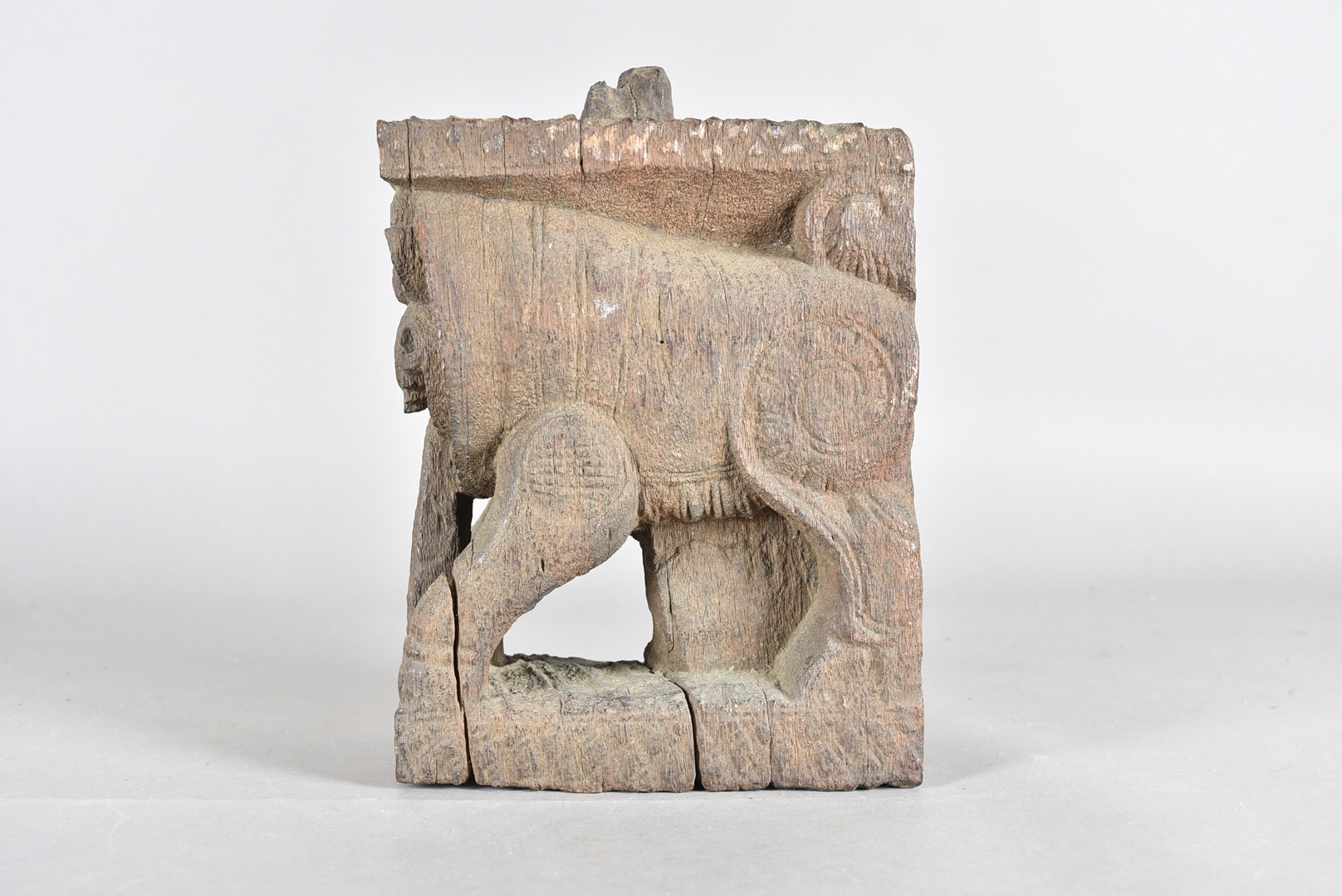 An early Indo Chinese carved temple dog, modelled with a protruding tongue in carved hardwood, - Image 2 of 2