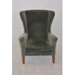A Parker Knoll fireside easy chair, in green fabric, 92cm high