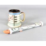 Neil Johns, two studio pottery terracotta musical items, including a recorder and musical notes