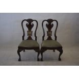 A set of six early 20th Century mahogany Queen Anne-style dining chairs, with carved double-