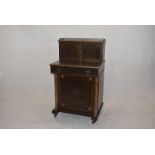 A late Victorian Bonheur du Jour, having inlaid design, upper cupboard with galleried top, pull