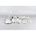 A collection of Swarovski crystal items, including butterflies, hedgehogs, bears, swans and more,