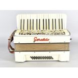 A 1950s Geraldo accordion, in simulated mother of pearl, in fitted case