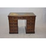 A 19th Century mahogany pedestal desk, with inset tooled leather, worn, above eleven drawers, 79cm