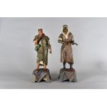 A pair of 19th Century continental spelter figures, modelled as North African gentlemen, on carpet