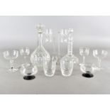 A collection of glassware, including six champagne bowls, various whisky glasses, decanters and