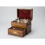 An early 19th Century mahogany Medicine Chest, with two out of three large stoppered bottles, nine