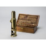 An early 19th Century lacquered brass Drum Microscope, with eyepiece and six objectives, 250mm high,