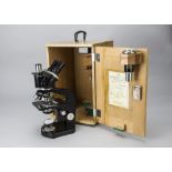 A Nikon Tri-nocular Microscope, serial no. 51503, black, four objectives, monocular tube, and