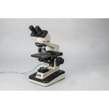 A Nikon Alphaphot II YS2-H Microscope, serial no. 150701, with two objectives, cream and black