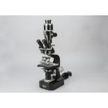 A Nikon Tri-nocular Microscope, serial no. 42619, black, five objectives, Nikon AFM camera adapter