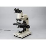 A Nikon Labophot Microscope, serial no. 231777, cream, four objectives, with Optizoom head, 0.8 -