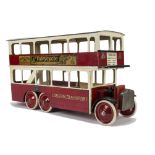 A large Tri-ang Wooden London Transport Double-Deck Bus, painted red and cream with tinplate General