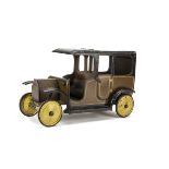 A Lines Bros Wooden Doll's Motor Car, painted brown and black with cream and black lining, open cab,