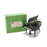A Tri-ang Period Dolls' House Grand Piano, QA20, ebony finish, in original green box --5½in. (14cm.)
