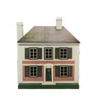 A Triangtois Wooden Dolls' House DH/9, rough-cast and brick-paper façade, central front door with