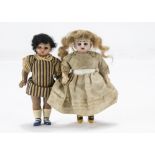 A German brown bisque head Dolls' House doll, with brown glass eyes, black mohair wig, composition