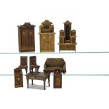 Oak Dolls' House Furniture, an extending dining table with two leaves --4¼in. (10.5cm.) wide,