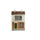 A Triangtois Size B Dolls' House, with cream-painted rough-cast façade upper, brick-paper lower,