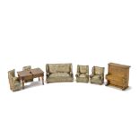 A German Dolls' House Sitting Room Set, comprising floral printed upholstered sofa with brass lion