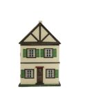A Triangtois Dolls' House Cottage, possibly DH C, cream-painted with timbered gables, four