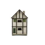 A small Tri-ang Wooden Size O Dolls' House, rough-cast and timbered façade, green front door with