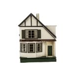 A Tri-ang A symmetrical Wooden Size D Dolls' House, rough-cast façade, timbered gable, green front