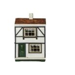 A Triangtois Size A Dolls' House circa 1924, with timbered and rough-cast façade, green front door