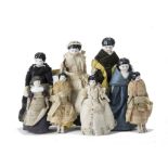 Eight china shoulder-head Dolls' House Dolls, one dressed as maid --6¼in. (16cm.) high, three others