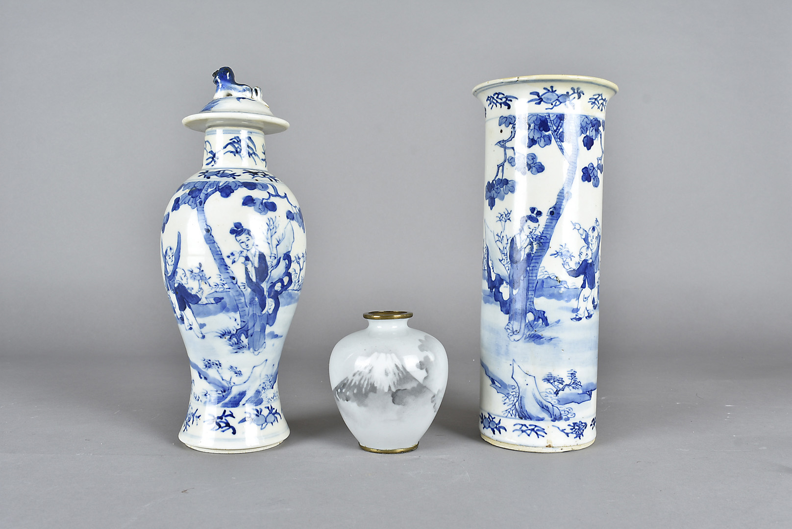 A Chinese baluster vase and cover, blue and white decorated with children and figures in a