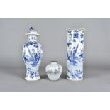 A Chinese baluster vase and cover, blue and white decorated with children and figures in a