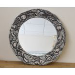 A 1950s mirror, having ceramic fruit and leaf surround, 59 cm diameter