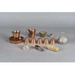 A silver plated pomander, together with a group of five copper miniature jelly moulds, plus a