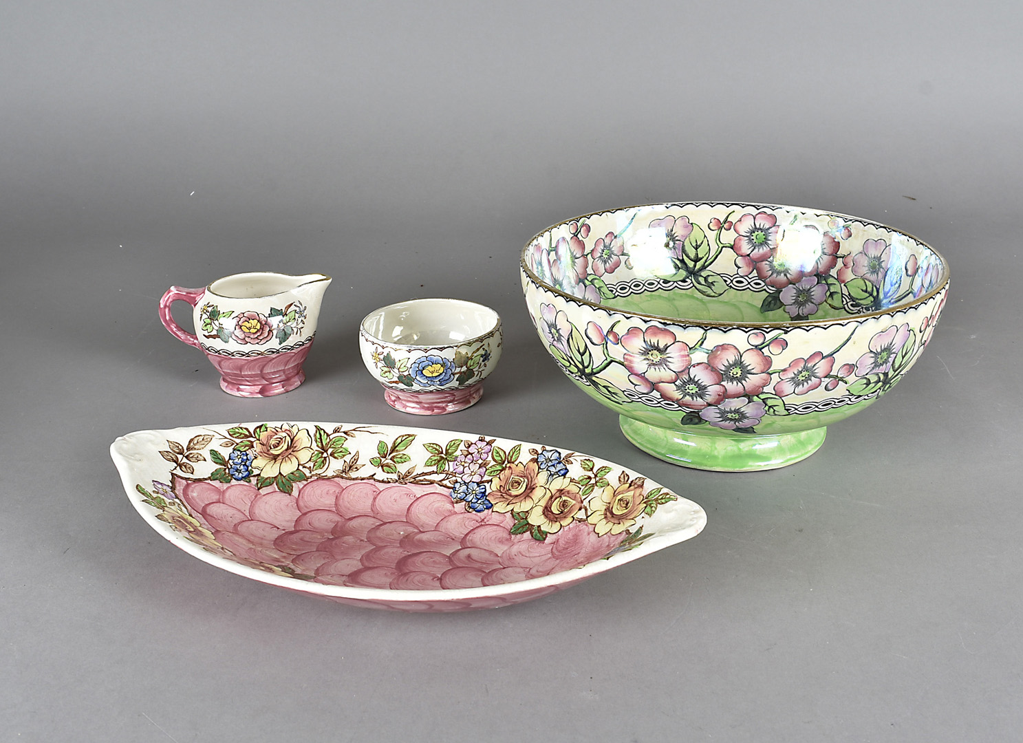 Four pieces of Maling lustreware, comprising a large bowl, an oval dish, a small bowl and a small