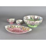 Four pieces of Maling lustreware, comprising a large bowl, an oval dish, a small bowl and a small