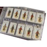 Foreign Cigarette Cards, Wills, Military Related, held in a modern ring-binder a collection of