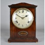 A W.E Gray mantle clock, in mahogany case, with eight day movement, silver dial with Roman numerals