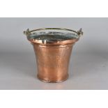 An Arts and Crafts copper and brass ice bucket/wine cooler, tapered circular design, with engraved