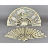 An early 19th Century bone and silk folding hand fan, the silk leaf with pierced sections, painted