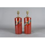 A pair of Poole pottery table lamps, having red ground, with blue, orange and green decoration, 31.