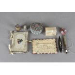 A collection of sewing related items, including a horn and bead work circular box and cover, a