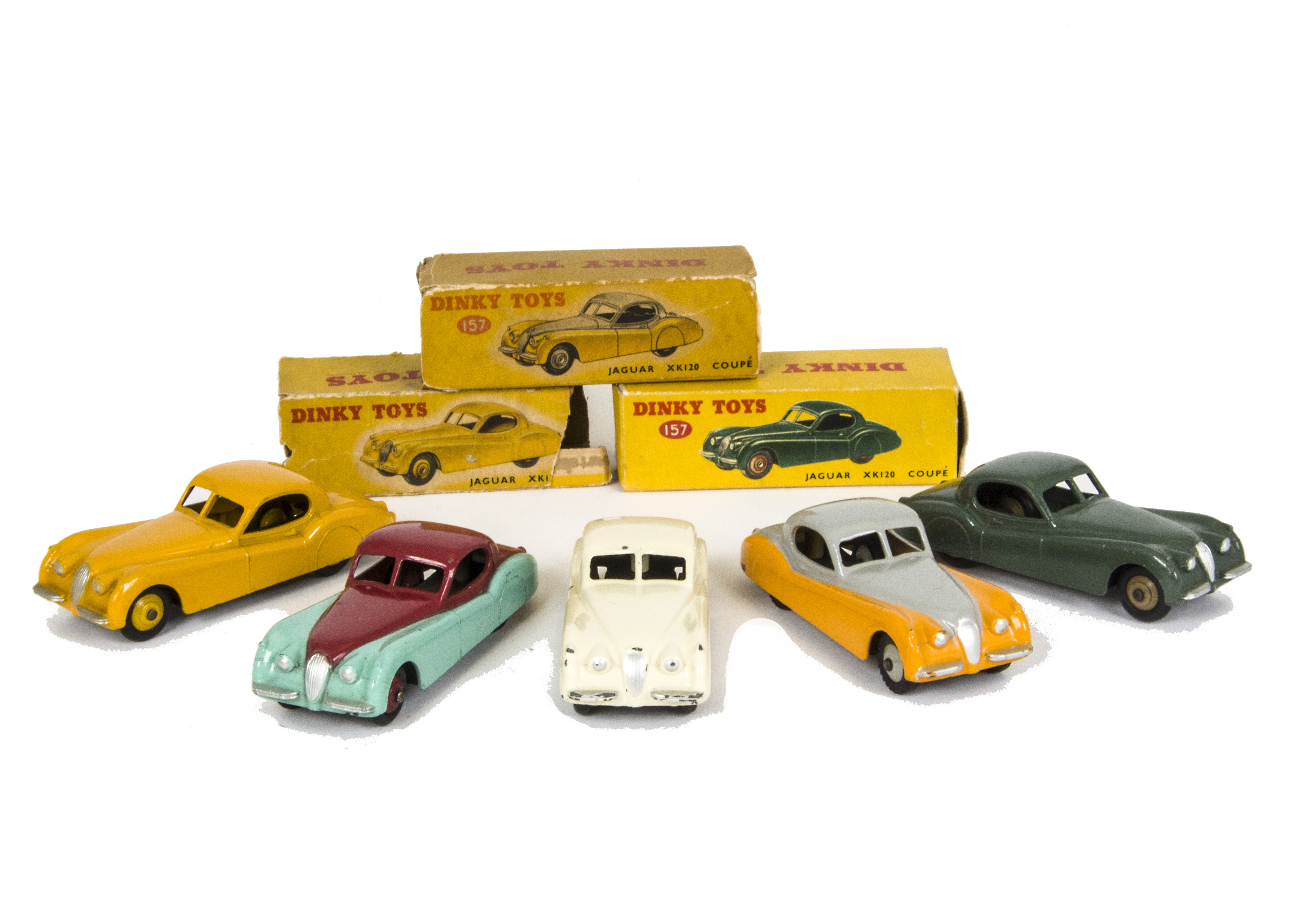 Dinky Toys 157 Jaguar XK120 Coupe, five examples, first yellow body, light yellow hubs, second